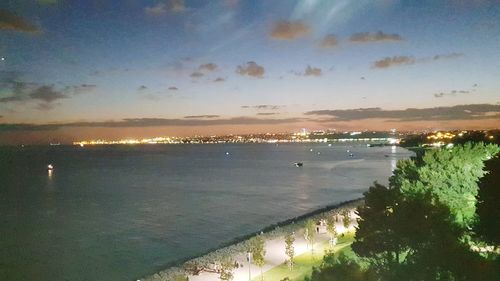 High angle view of sea against sky at sunset