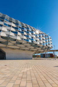 Low angle view of building against blue sky