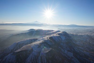 High angle view of mountains against sky during winter