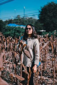 Full length of woman standing on field