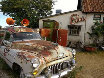 Abandoned car on tree