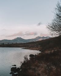 Scenic view of lake against sky during sunset