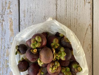 High angle view of grapes in plate on table