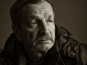 Close-up of senior man looking away