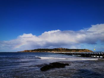 Scenic view of sea against blue sky