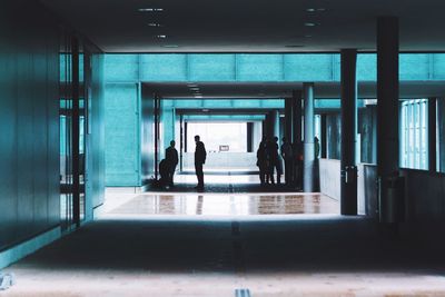 People standing in passage of building