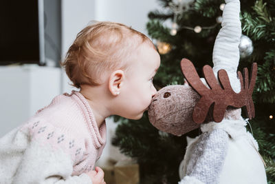 Cute baby girl at home during christmas