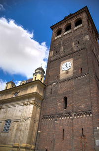 Low angle view of clock tower against sky