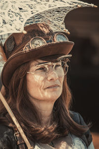 Portrait of a smiling young woman wearing sunglasses