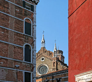 Low angle view of bell tower against sky