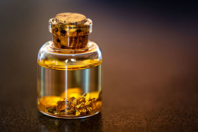 Close-up of glass bottle on table