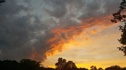 Low angle view of dramatic sky during sunset