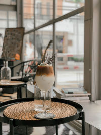 Table and chairs in glass window