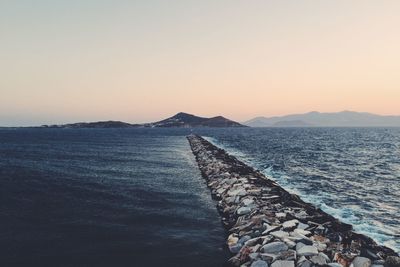 Scenic view of sea against clear sky during sunset