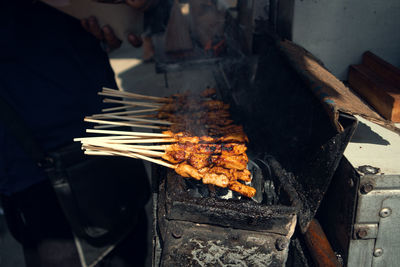 High angle view of person preparing food, sate indonesian food