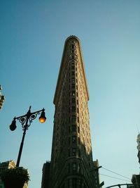 Low angle view of flatiron building against clear sky