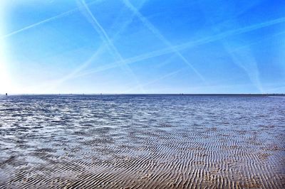 Scenic view of sea against clear blue sky