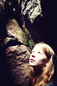 Close-up of young woman against tree