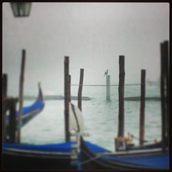 Boats in sea against sky