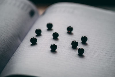 Pearls forming pattern on book