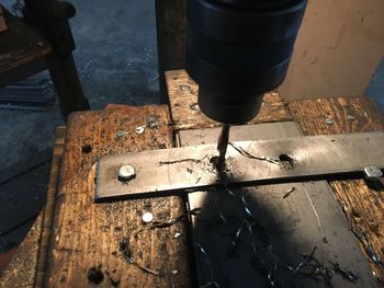 High angle view of chain on wood