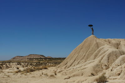 Scenic view of landscape against clear blue sky