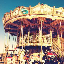 Low angle view of carousel at amusement park