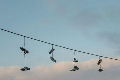 Low angle view of cables against clear sky