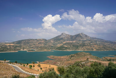 Panoramic view of sea and mountains against sky