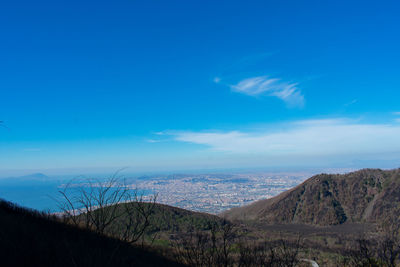 Scenic view of landscape against blue sky