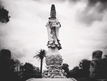 Low angle view of statue against sky