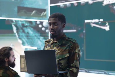 Portrait of man using digital tablet