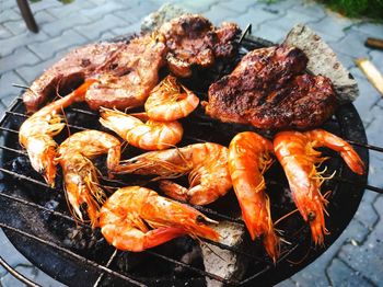 High angle view of seafood on barbecue grill