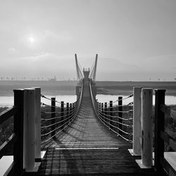 Pier over sea against sky