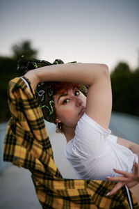 Mixed heritage asian-spanish young female posing with head hanky