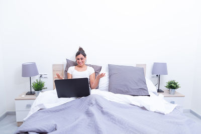 Woman using laptop at home