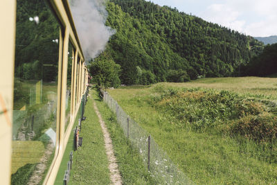 Old-fashioned locomotive train emitting smoke