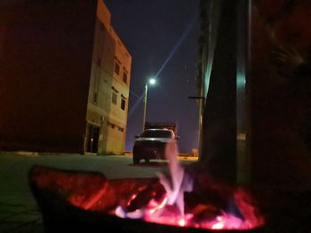 View of lit candles on table