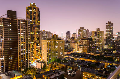 High angle view of illuminated buildings in city at night