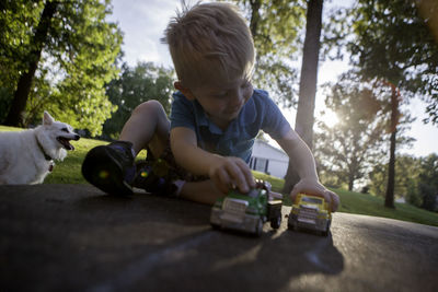 Boy playing with toy cars