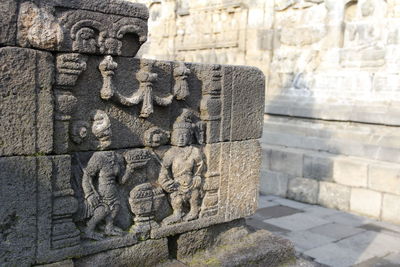 Beautiful bas-relief wall decor carved in stone at borobudur temple, yogyakarta, indonesia