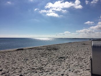 Scenic view of sea against cloudy sky