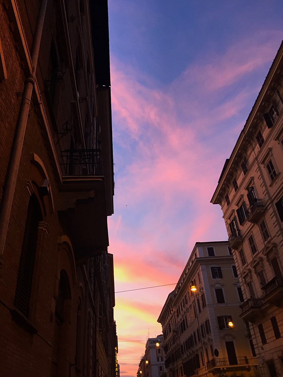 architecture, built structure, building exterior, sunset, sky, low angle view, no people, cloud - sky, outdoors, travel destinations, city, day