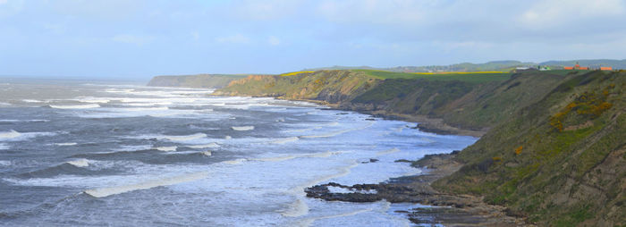 Scenic view of beach against sky