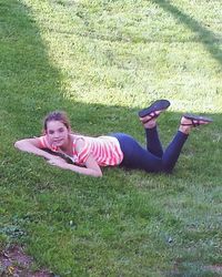 High angle view of woman lying on grass