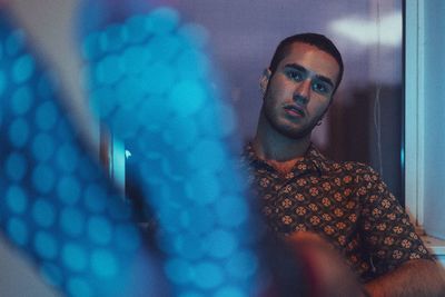 Portrait of young man relaxing at home