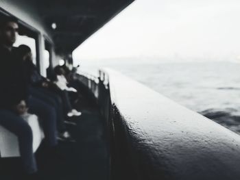 People in bus by sea