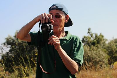 Man photographing with camera