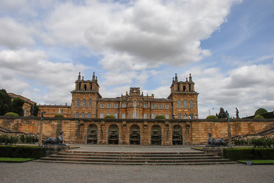 View of old building against cloudy sky