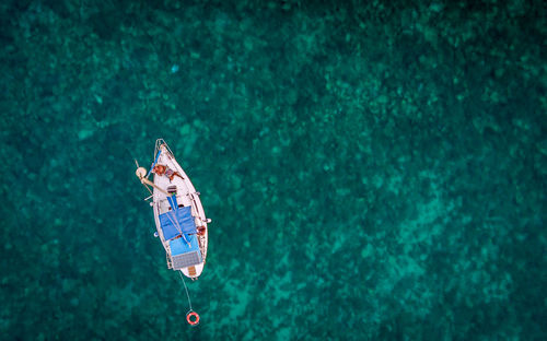 High angle view of woman swimming in sea